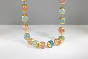 Todd Reed necklace made with 18k yellow gold and pastel colored baryl beads